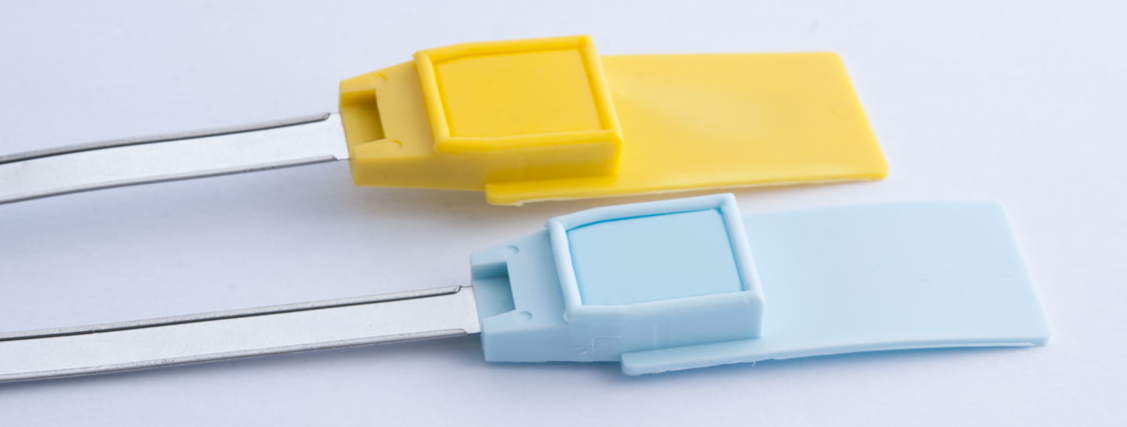Metal locking system encapsulated by plastic