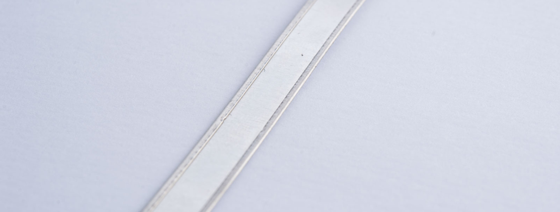 Rolled metal strap edges